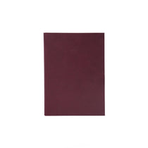 Maroon notebook on a white background