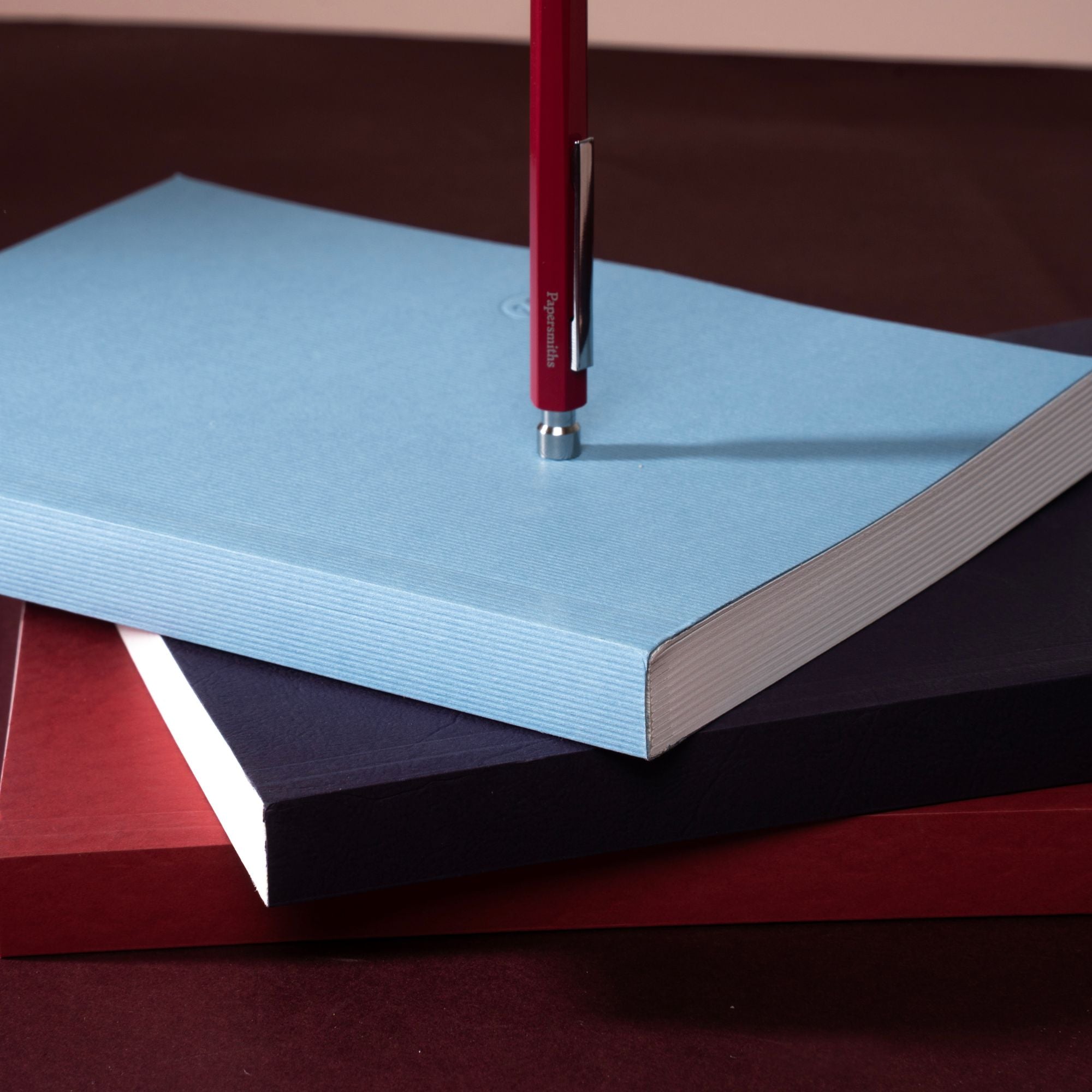 stack of books for aw26
