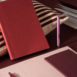 red notebook flatlay