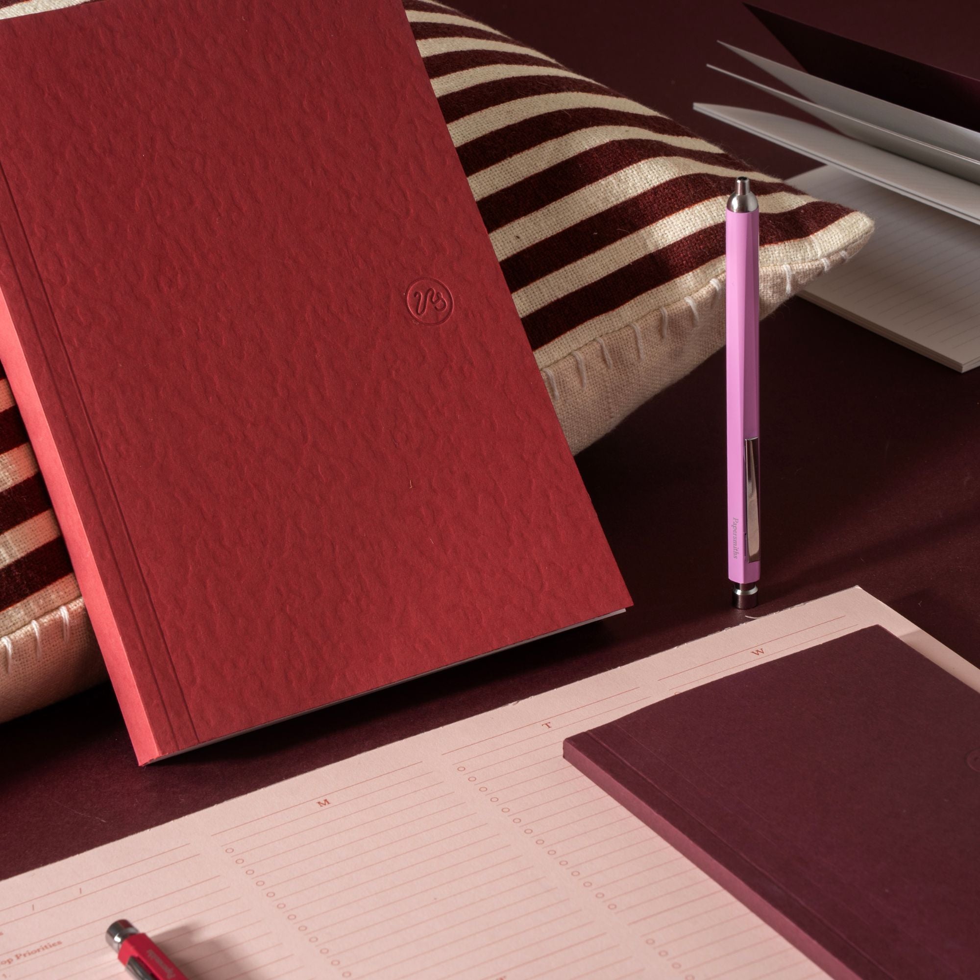 red notebook flatlay