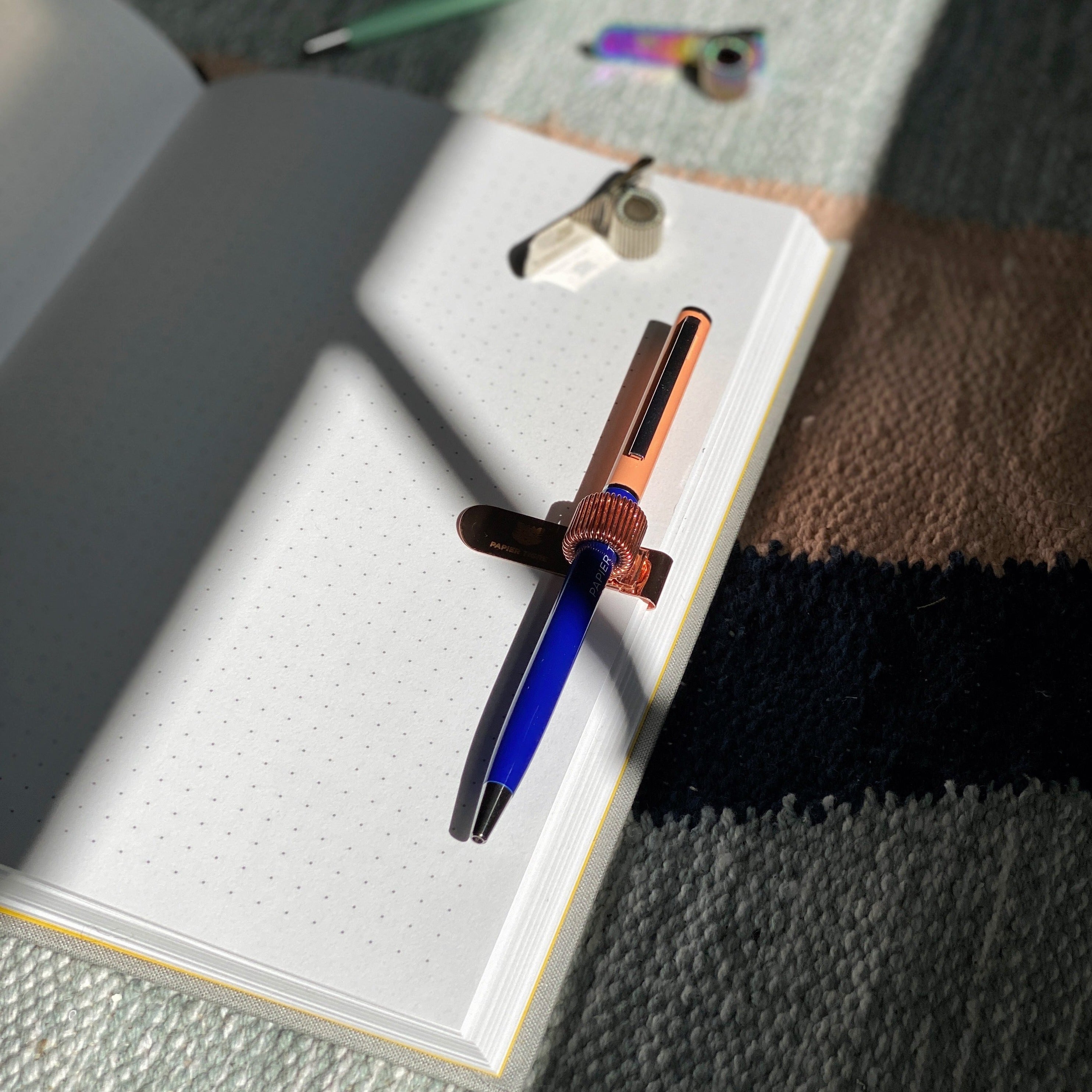 pen clipped to notebook