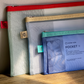 red yellow and aqua mesh pen pouches
