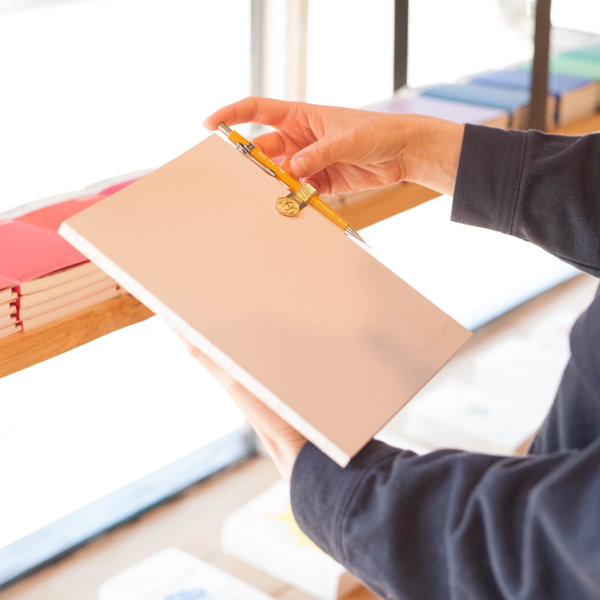 Gold Pen Clip attached to Notebook